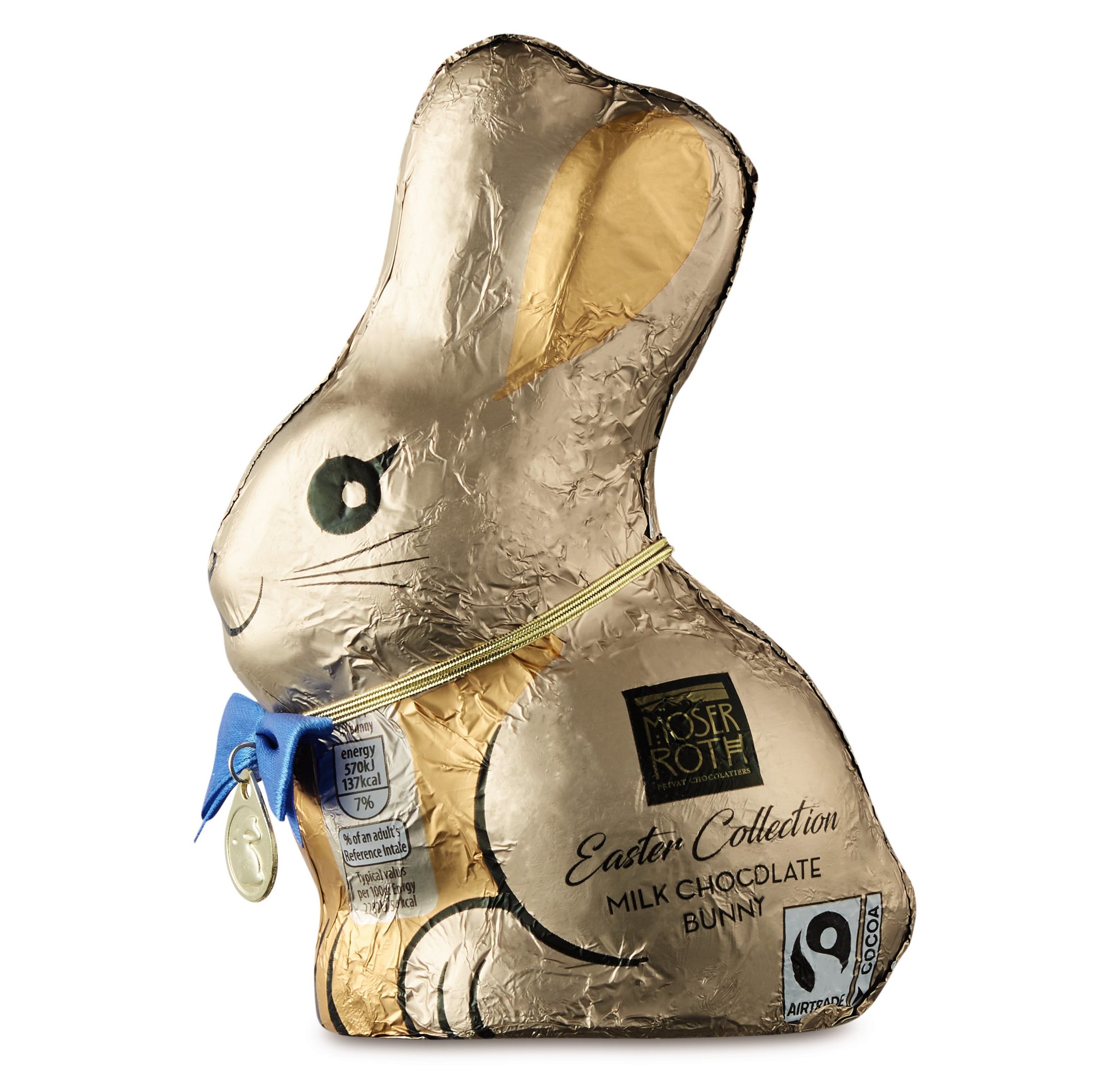Chocolate bunny wrapped in gold foil and finished with a blue bow ribbon around its neck.
