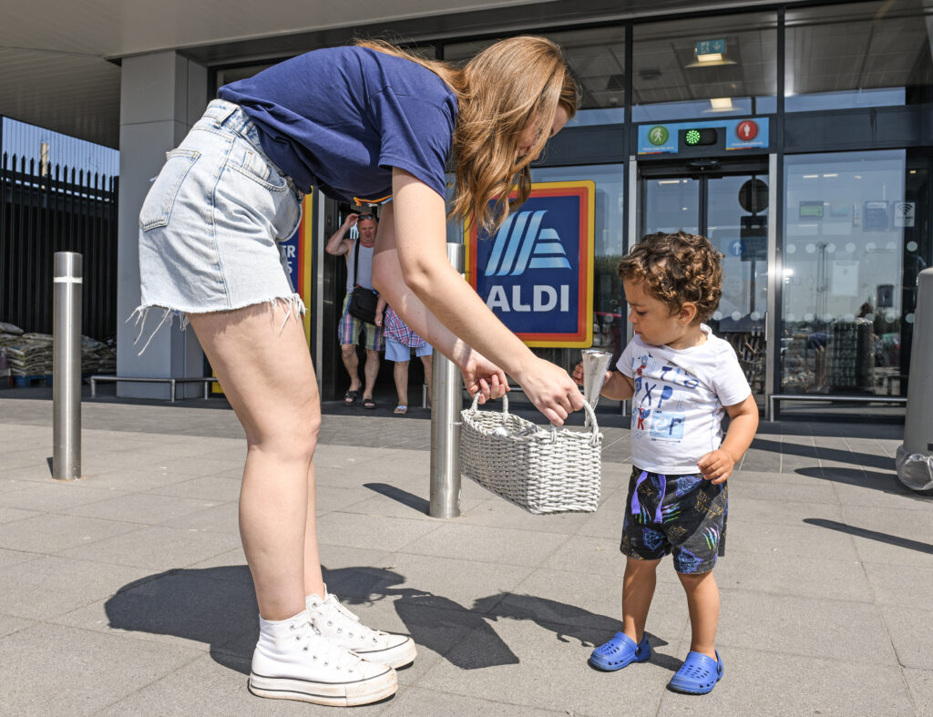 Pictured: Aldi giveaway ice creams outside the store in Greenwich.  Budget supermarket Aldi today come to the rescue for people in a London Borough where ice cream vans have been banned - by handing out free frozen desserts.  Greenwich Council shocked locals this week when it published a list of streets across Greenwich and Woolwich town centres where ice cream vans could be prohibited from trading during the summer months. But Aldi stepped in to help and offered Londoners the cool treats as the warm weather continues - and even offered a chance of winning free ice cream.  Visitors to the Greenwich store on Brocklebank Road could be lucky enough to scoop up to 23 ice creams with a £5 voucher. SEE OUR COPY FOR DETAILS. © Solent News & Photo Agency UK +44 (0) 2380 458800