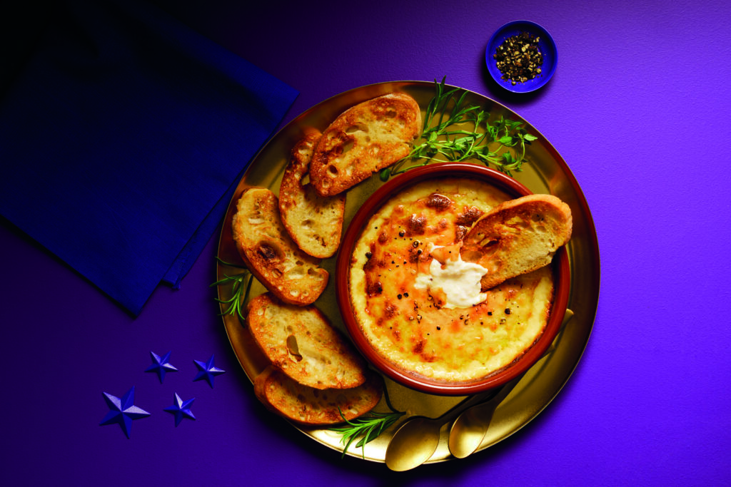 Aldi's cheddar bake on a plate with toasted bread slices