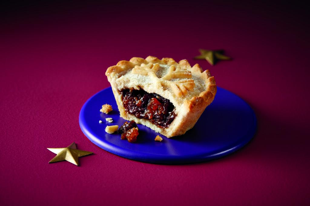 Aldi Deep Filled Mince Pie cut in half to show filling on small plate