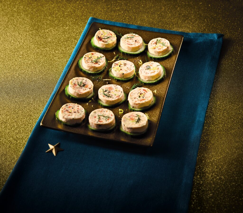 12 mini canapes on a gold plate