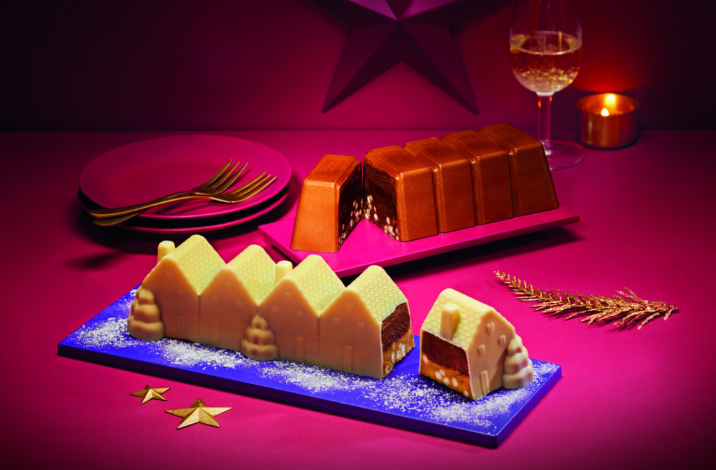 Aldi's Gastro Ganache Showstopper in milk and white chocolate shaped at festive houses and a segmented bar