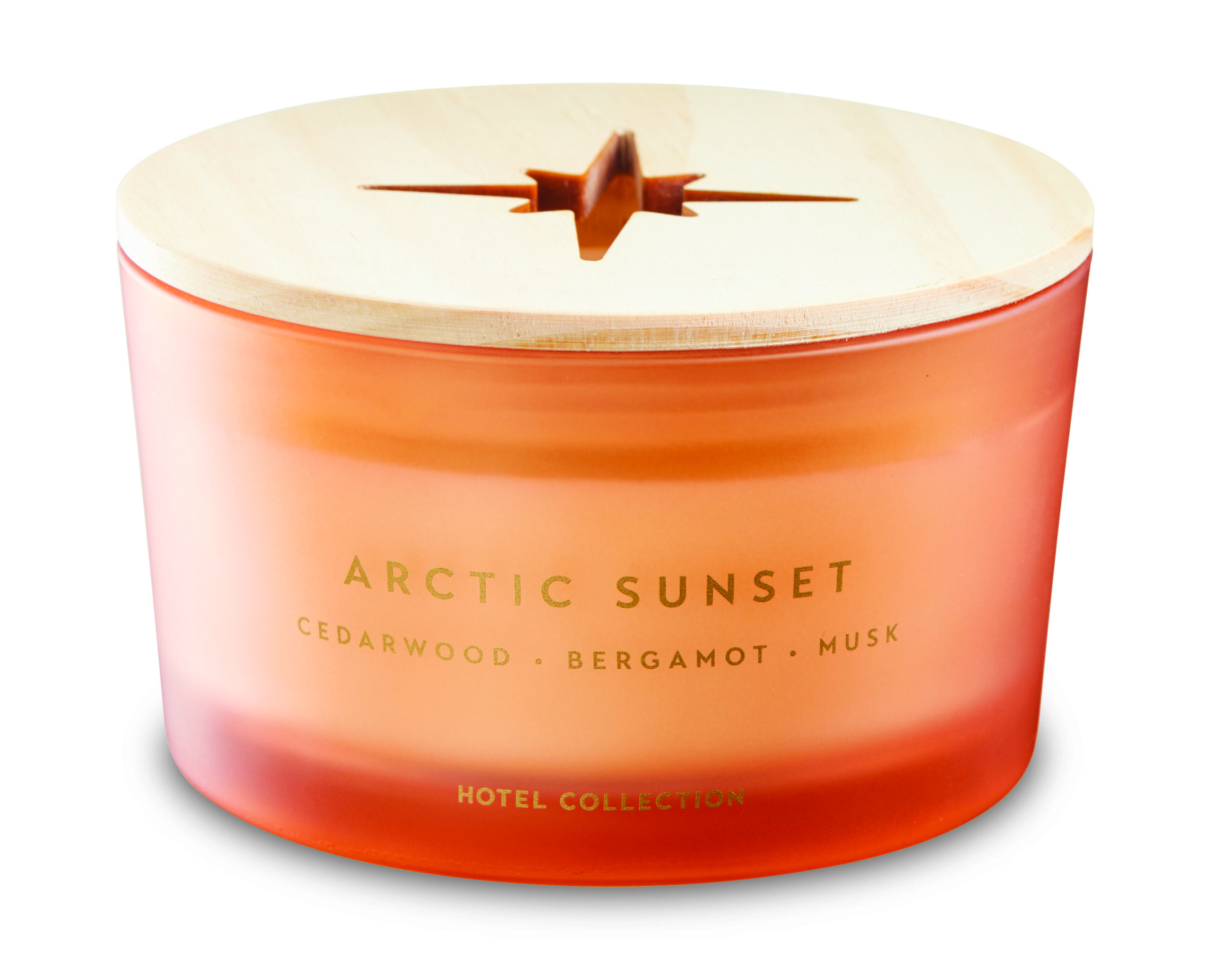 An orange glass candle with a wooden lid with a star cut out.